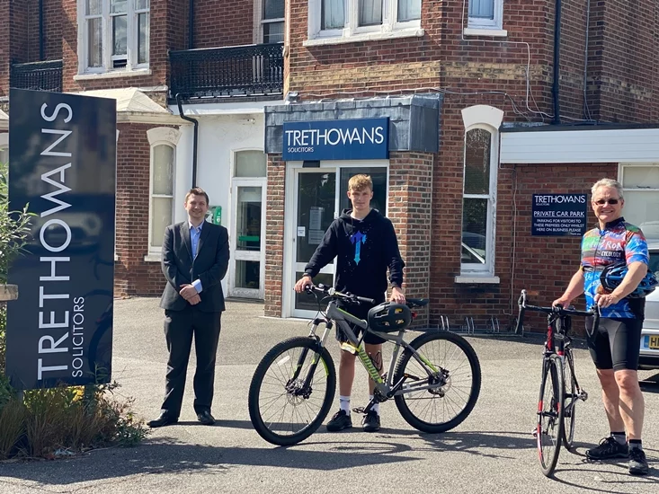 James Braund standing with bikes for charity