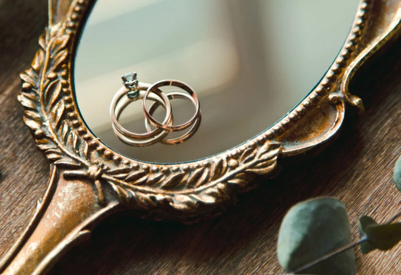 2 wedding rings on mirror