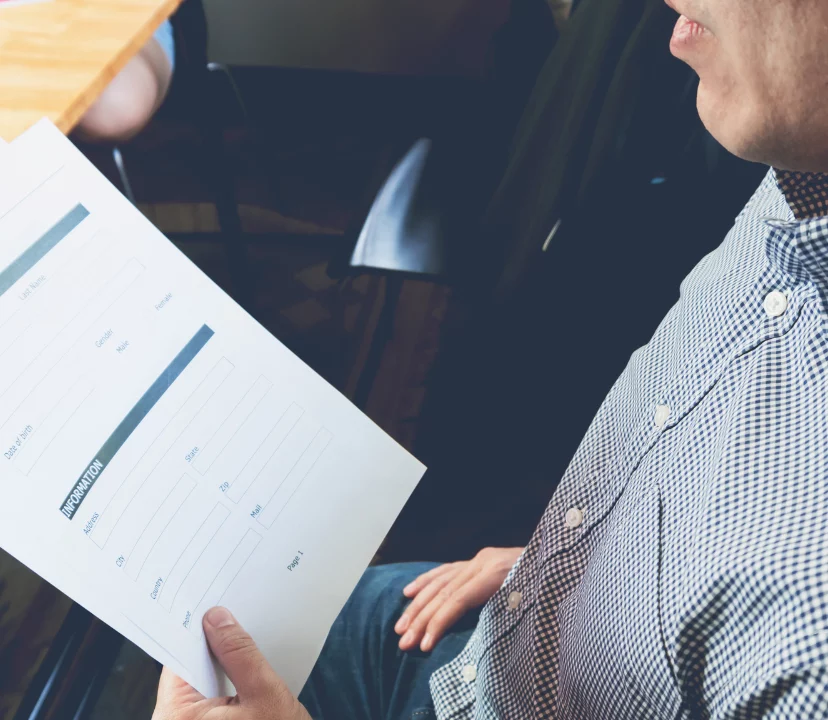 man looking at insurance document