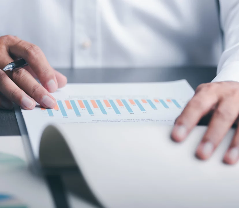 Man looking at graph and analytics