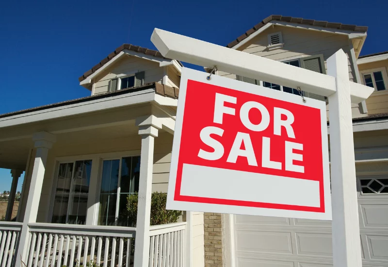 For sale sign outside of house