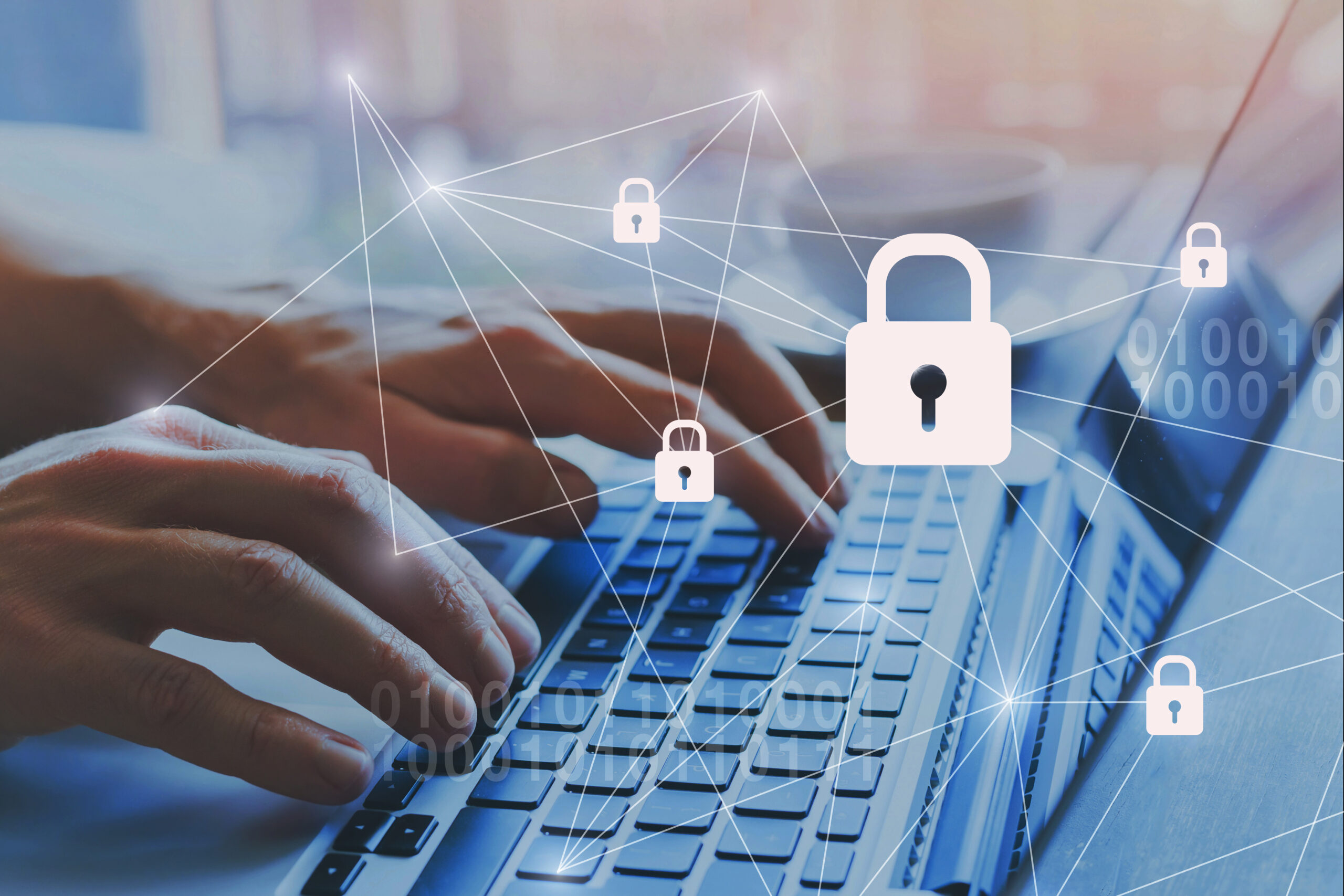 Man typing on laptop with padlock and blockchain